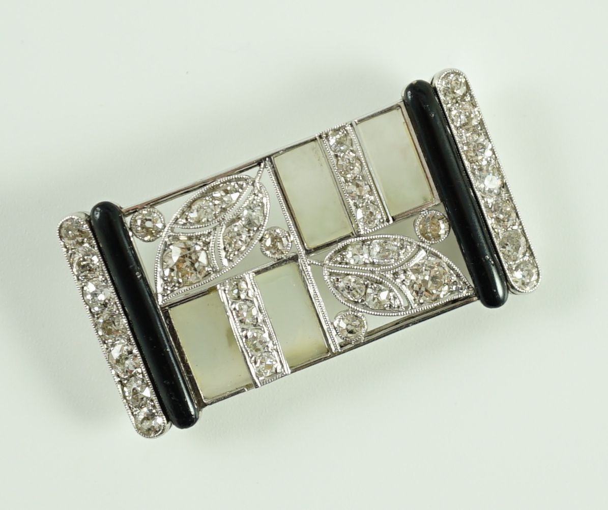 A 1930's/1940's Austro-Hungarian white gold, millegrain set diamond, frosted glass and black enamel rectangular brooch